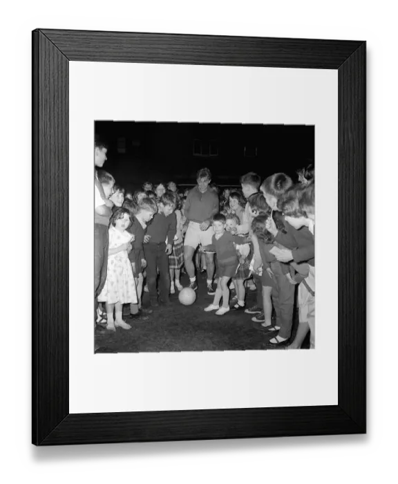 Framed Print : British rocker Tommy Steele playing football with children of the Tachbrook Estate in Framed Print : British rocker Tommy Steele playing football with children of the Tachbrook Estate in