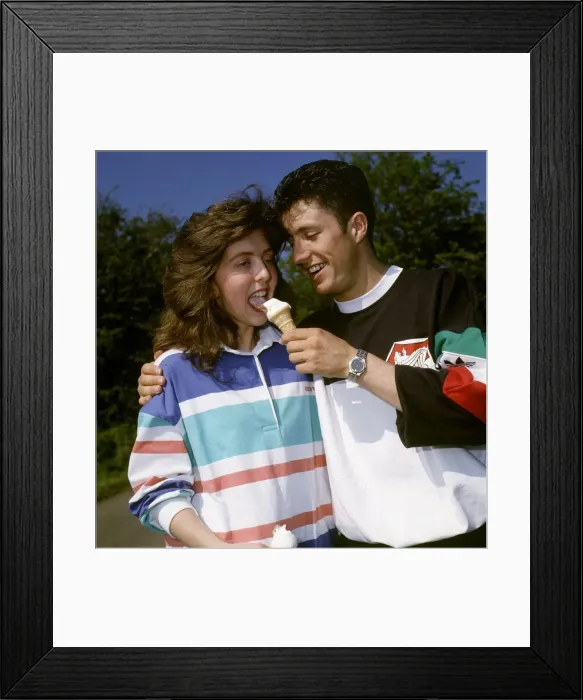 Framed Print : John Collins feeds ice cream cone to Susan Allan May 1990