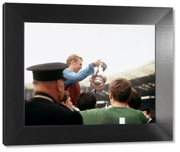 Bobby Moore holding the trophy after West Ham United beat Preston North End in the FA Cup