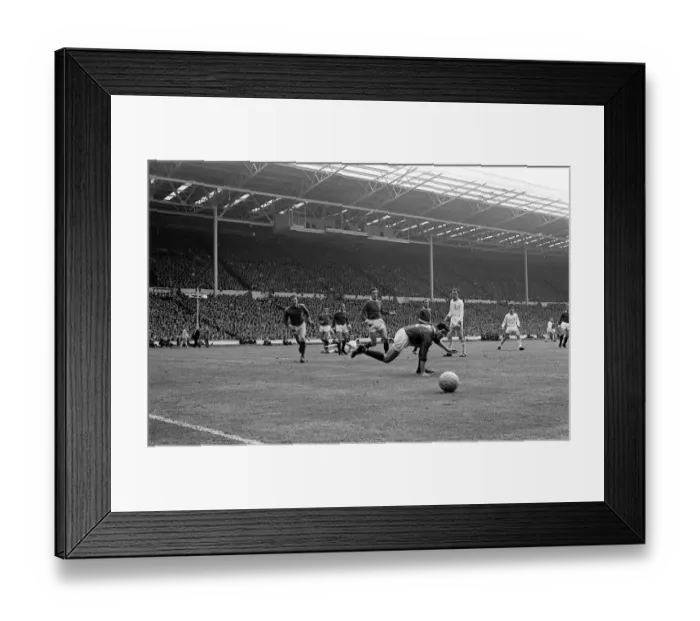 Framed Print : Manchester United defence watch the ball go to safety during the Manchester United