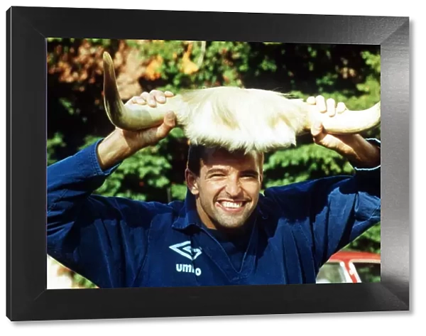Wolverhampton Wanderers footbaler Steve Bull football holding up a pair of cow horns to