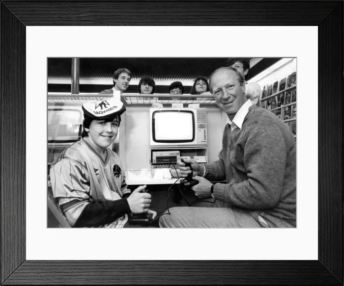 Framed Print : Newcastle United manager Jack Charlton playing on a computer game in November 1984