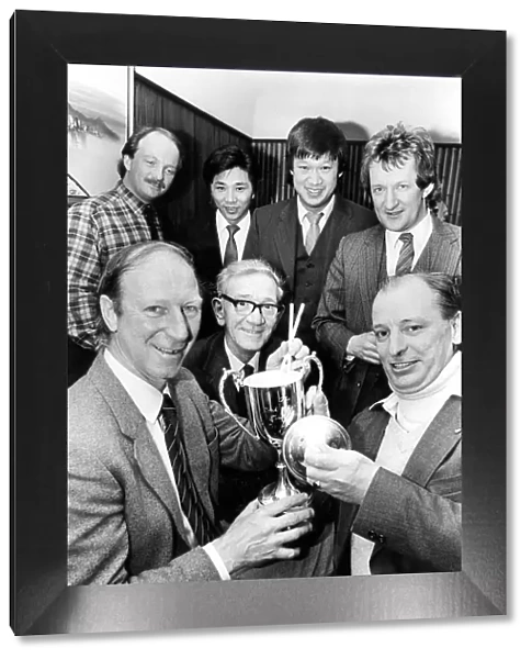 Newcastle United manager Jack Charlton presents an angling trophy to angling club