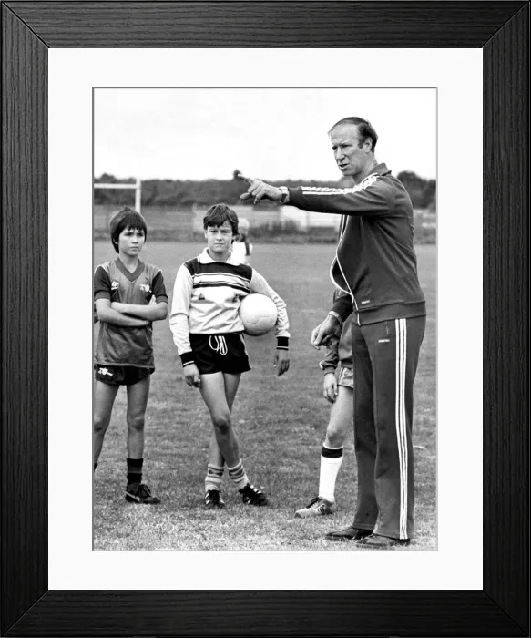 Framed Print : Jack Charlton shows off his skills at a coaching session in August 1983 Framed Print : Jack Charlton shows off his skills at a coaching session in August 1983