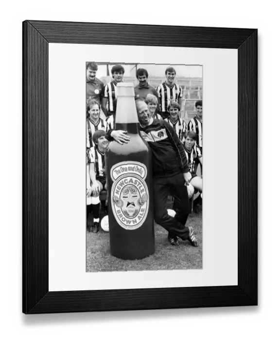 Framed Print : Newcastle United manager Jack Charlton clowns around with a giant bottle of Newcatle Framed Print : Newcastle United manager Jack Charlton clowns around with a giant bottle of Newcatle