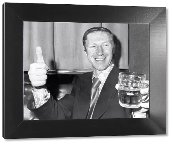 An exuberant Jack Charlton of Leeds United celebrates with a pint