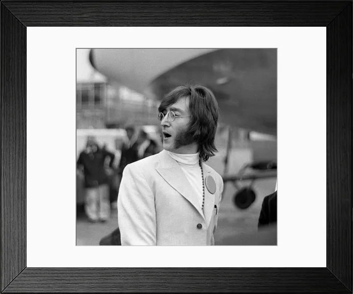 Framed Print : John lennon at Heathrow aiport for the The Beatles visit to India to meet Maharishi