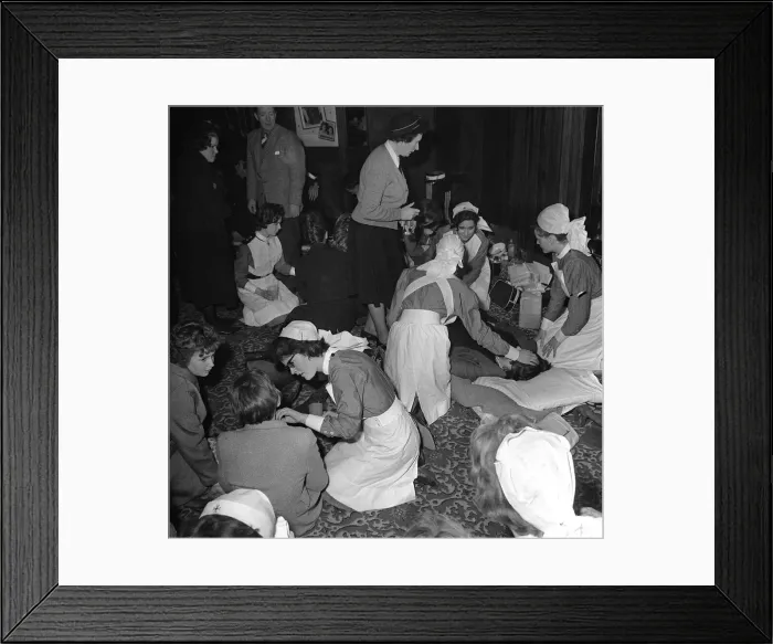Framed Print : Nurses tend to fans injured in a crush during a performance by British pop group Framed Print : Nurses tend to fans injured in a crush during a performance by British pop group