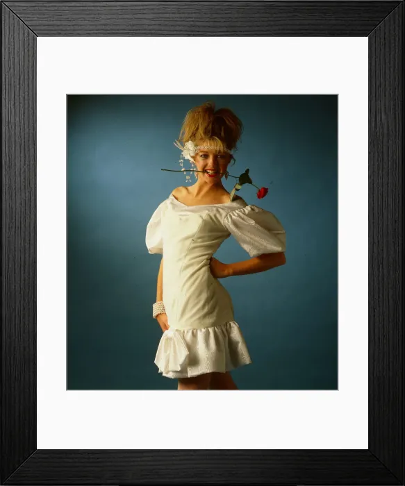 Framed Print : Wedding dress fashion, June 1986 model wearing white mini dress with rose flower in