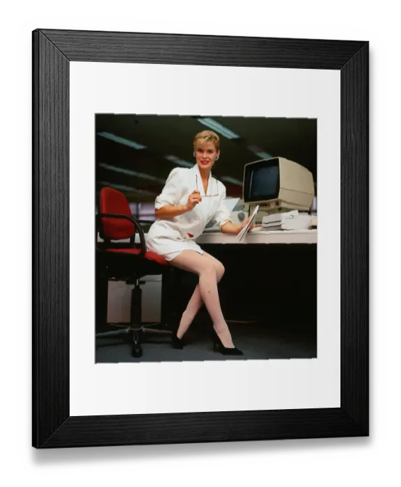 Framed Print : Model poses as secretary in Editorial wearing white suit Framed Print : Model poses as secretary in Editorial wearing white suit