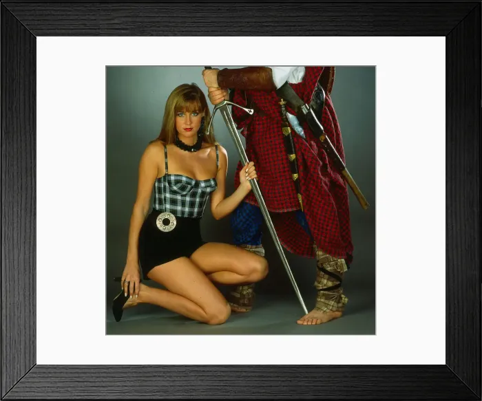 Framed Print : Tartan underwear fashion 1989 model wearing tartan with highland warrior and sword Framed Print : Tartan underwear fashion 1989 model wearing tartan with highland warrior and sword