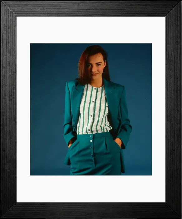Framed Print : Fashion female suits 1988 Model wearing turquoise suit Framed Print : Fashion female suits 1988 Model wearing turquoise suit