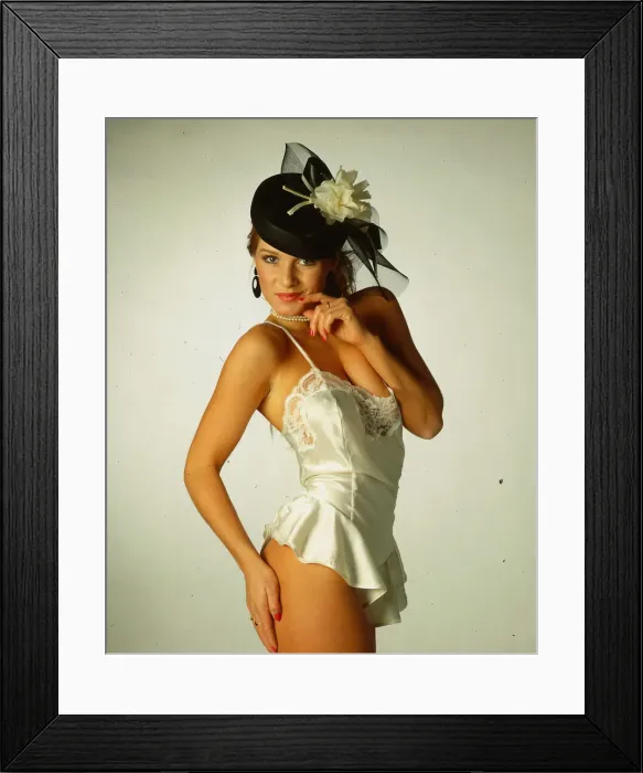 Framed Print : Hat Fashion Model wears black pill box hat with cream flower Framed Print : Hat Fashion Model wears black pill box hat with cream flower