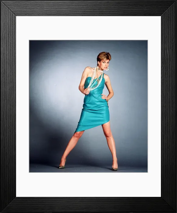 Framed Print : 1980s Dress and Fashion Model wearing turquise leather dress 1986 Framed Print : 1980s Dress and Fashion Model wearing turquise leather dress 1986