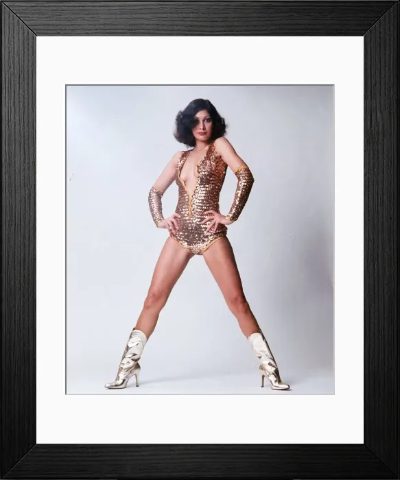Framed Print : Fashion 1970s Leotard and gold glitter boots in a Wonder Woman style Framed Print : Fashion 1970s Leotard and gold glitter boots in a Wonder Woman style