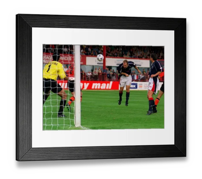 Framed Print : Dariusz Adamczuk Sept 1998 heads the equaliser for Dundee Framed Print : Dariusz Adamczuk Sept 1998 heads the equaliser for Dundee