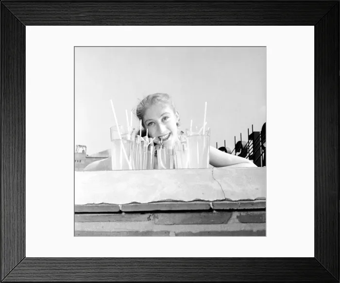 Framed Print : Dorothy Penny, glamour shoot, July 1955 Young woman sunbathing in bkini on a wall