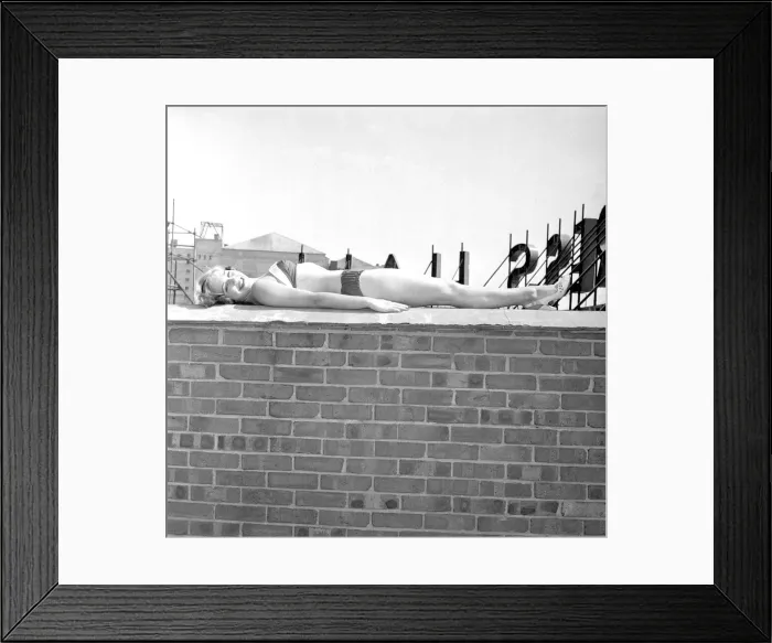 Framed Print : Marlene Lister, July 1955 Young woman sunbathing in bkini on a wall of a roof Framed Print : Marlene Lister, July 1955 Young woman sunbathing in bkini on a wall of a roof