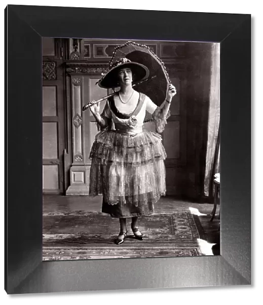 Ascot frock - June 1921 woman in dress holding a umbrella