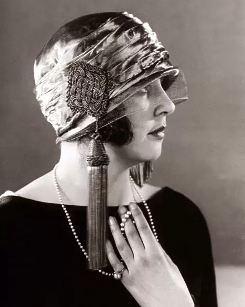 Hat fashion - April 1924 Woman wearing elaborate hat with tassles