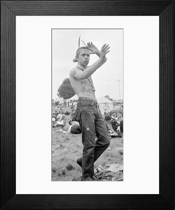 Framed Print : Flower Power festival at Woburn Abbey, August 1967 A hippy dressed with feathers in Framed Print : Flower Power festival at Woburn Abbey, August 1967 A hippy dressed with feathers in