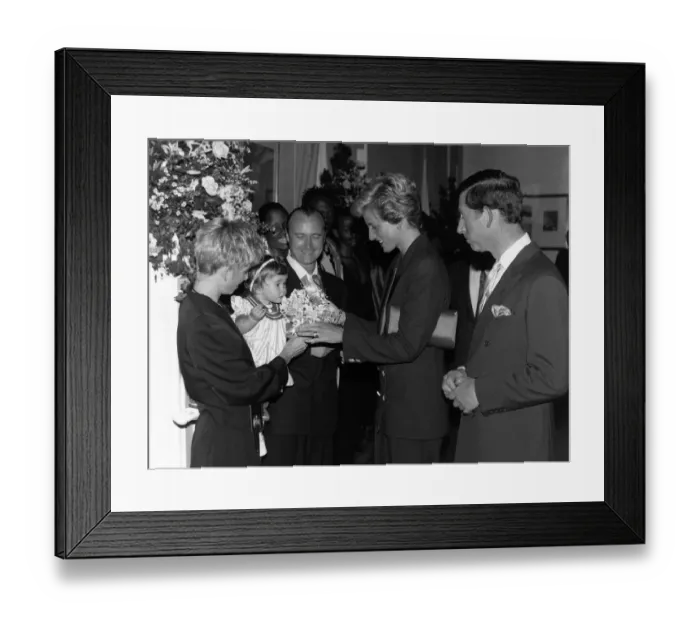 Framed Print : Phil Collins singer with wife Jill and daughter Lily in 1990 meet Princess Diana