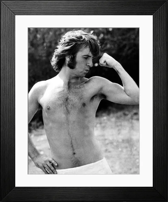 Framed Print : Q. P. R. star Stan Bowles shows of his muscles during Queens Park Rangers team training Framed Print : Q. P. R. star Stan Bowles shows of his muscles during Queens Park Rangers team training
