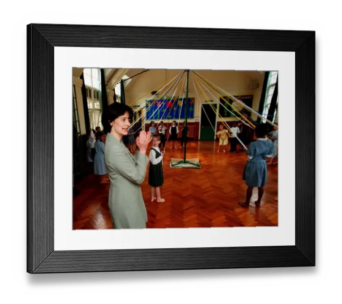 Framed Print : Cherie Blair wife of Tony Blair watches maypole dancing during a visit to Sudbourne