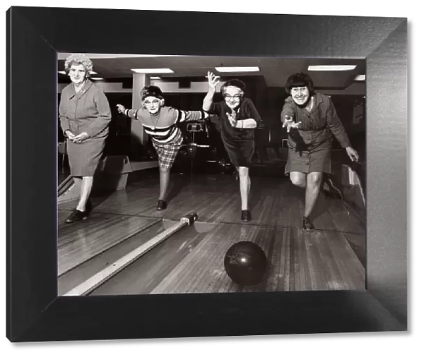 Four elderley women who are part of a newly formed tenpin bowling team practcie their