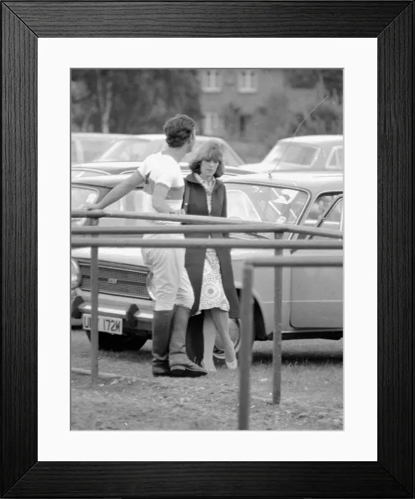 Framed Print : Prince Charles leans back on to railings as he chats with Camilla Parker Bowles during a Framed Print : Prince Charles leans back on to railings as he chats with Camilla Parker Bowles during a