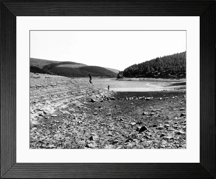 Framed Print : Derwent reservoir near Sheffield, showing the low water due to the continuing drought in Framed Print : Derwent reservoir near Sheffield, showing the low water due to the continuing drought in