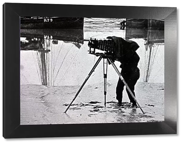 OLD PHOTOGRAPH OF A PHOTOGRAPHER ON THE BEACH MARCH 2001 USING A PLATE CAMERA ON