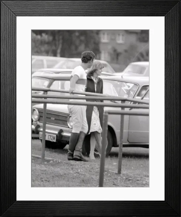 Framed Print : Prince Charles leans back on to railings as he chats with Camilla Parker Bowles during a Framed Print : Prince Charles leans back on to railings as he chats with Camilla Parker Bowles during a
