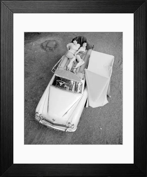 Framed Print : Two reveille models seen here demonstrating the new car rack tent