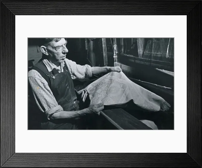 Framed Print : Textile Industry Ireland - worker holds up some material Weaving Cloth