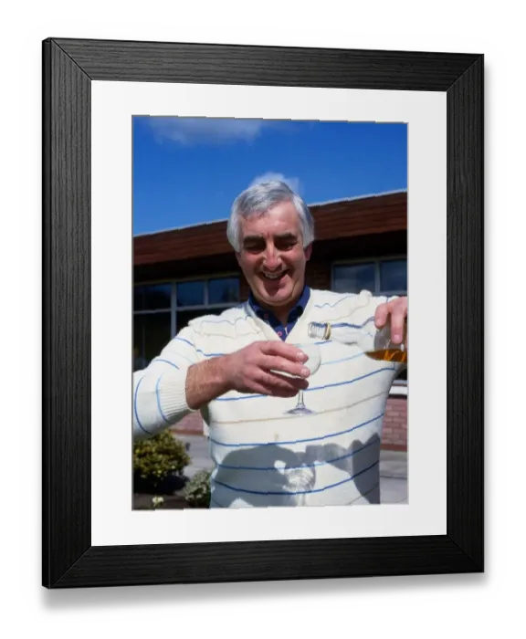 Framed Print : Davie Provan pouring glass of whiskey May 1989