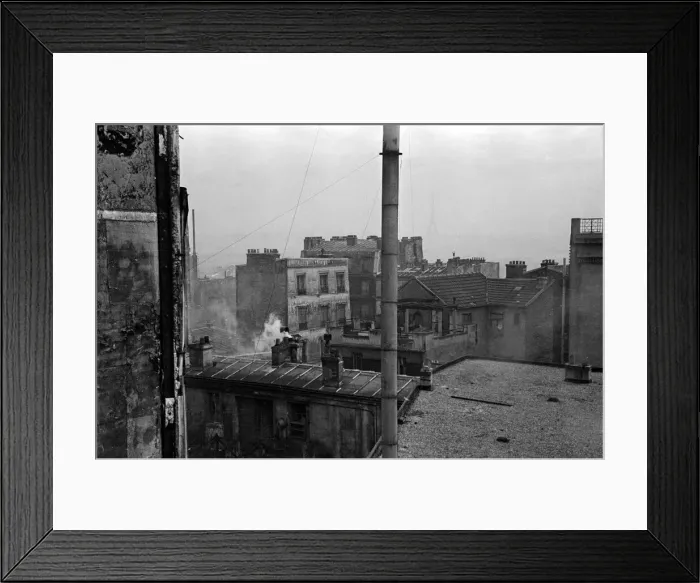 Framed Print : The Eiffel tower seen in the distance from the rooftops of the Artust quarter of Paris Framed Print : The Eiffel tower seen in the distance from the rooftops of the Artust quarter of Paris