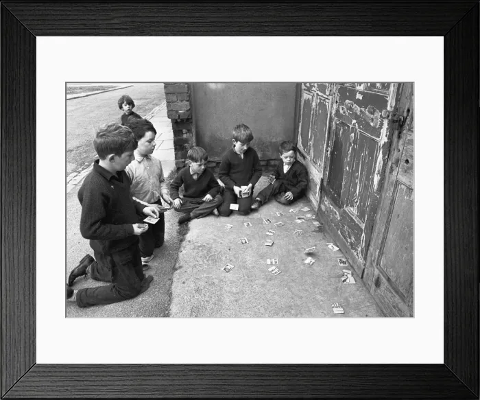 Framed Print : Memories of pre-war cigarette cards are stirred by this scene of young boys playing with Framed Print : Memories of pre-war cigarette cards are stirred by this scene of young boys playing with