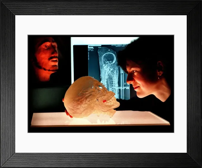 Framed Print : Katherine Erimin National Museum Scientist March 1998 with resin model skull of a Framed Print : Katherine Erimin National Museum Scientist March 1998 with resin model skull of a