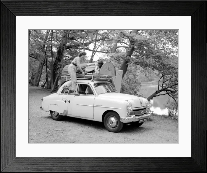 Framed Print : Two reveille models seen here demonstrating the new car rack tent Framed Print : Two reveille models seen here demonstrating the new car rack tent