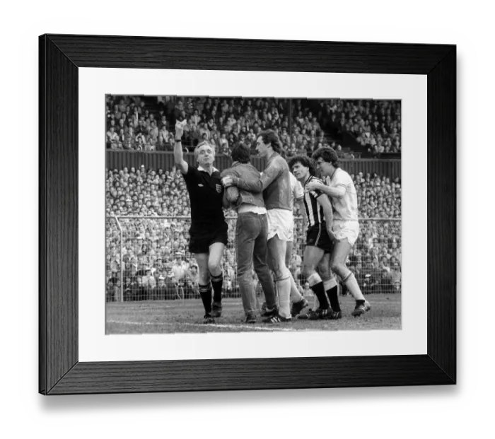 Framed Print : Kevin Keegan argues with a fan that has run on the pitch at St James Park 15 April 1984 Framed Print : Kevin Keegan argues with a fan that has run on the pitch at St James Park 15 April 1984