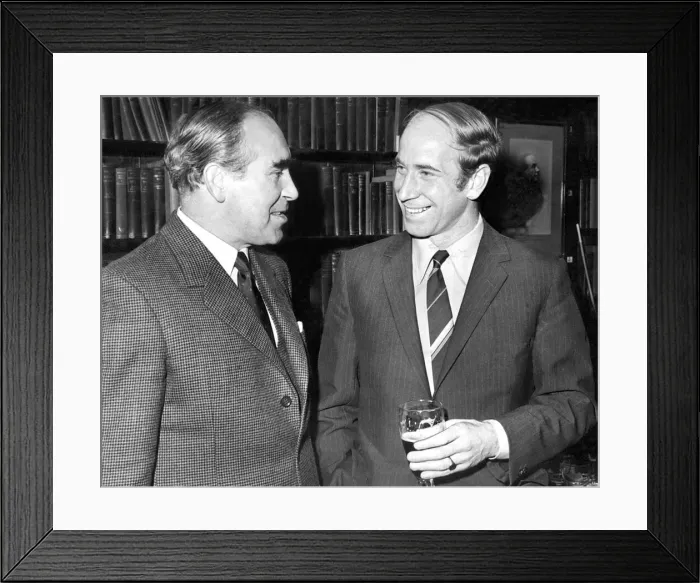 Framed Print : A smiling Bobby Charlton talking to England team manager Sir Alf Ramsey (left Framed Print : A smiling Bobby Charlton talking to England team manager Sir Alf Ramsey (left