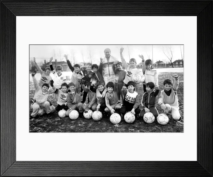 Framed Print : Bobby Charlton with youngsters at Soccer School at Monkton Stadium Framed Print : Bobby Charlton with youngsters at Soccer School at Monkton Stadium