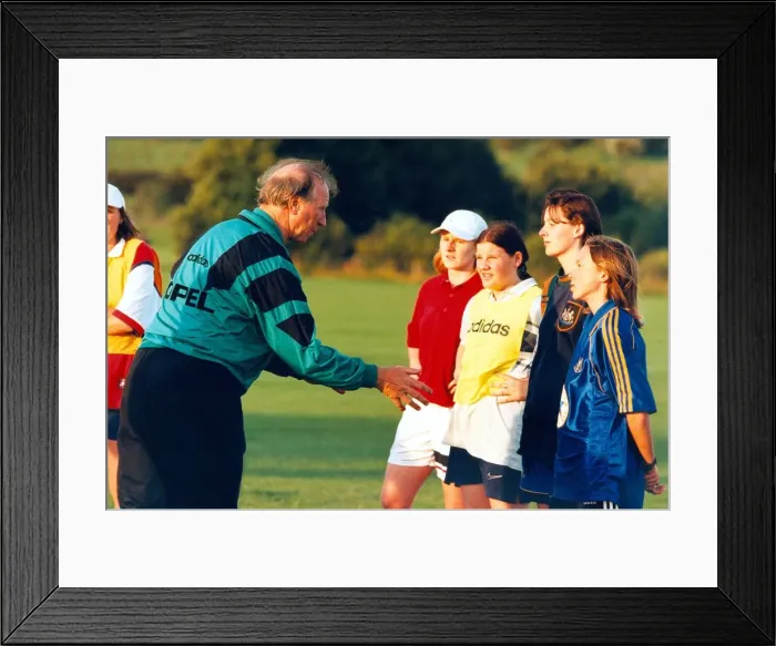 Framed Print : Jack Charlton coaching some of the girls from the North East football teams in August