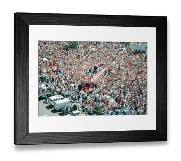 Framed Print : Thousands of England football fans line the streets near Luton airport to welcome their