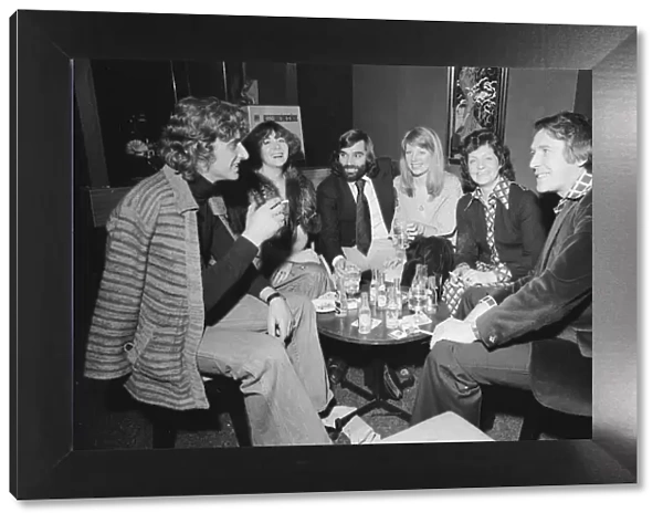 Footballer George Best with friends at his night club Slack Alice in Manchester