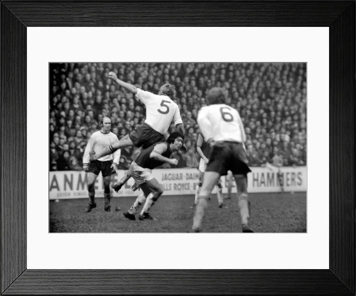 Framed Print : Football: West Ham vs. Burnley F. C. Burnleys Colin Waldren leaving heavily on Bobby