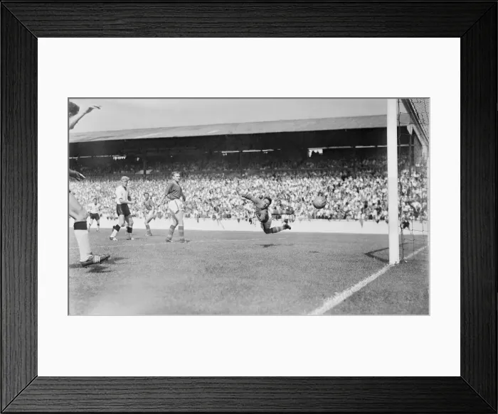Framed Print : English League Division One match. Burgin the Leeds goalie turns in mid air to see Framed Print : English League Division One match. Burgin the Leeds goalie turns in mid air to see