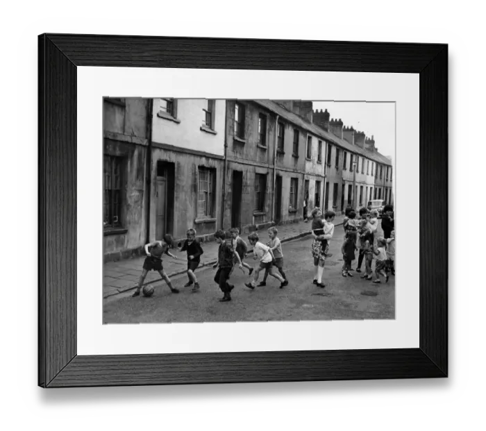 Framed Print : Children playing football in the street at Sandon Place, in Adamsdown