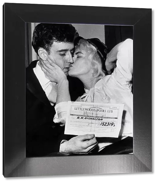Pools winner Vivienne Nicholson kisses her husband Keith Howard Nicholson
